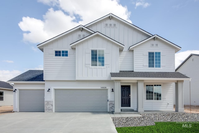 2059 N Thunderbolt St, Mountain Home, ID 83647 - view of front of home with board and batten siding, a shingled roof, concrete driveway, and an attached garage