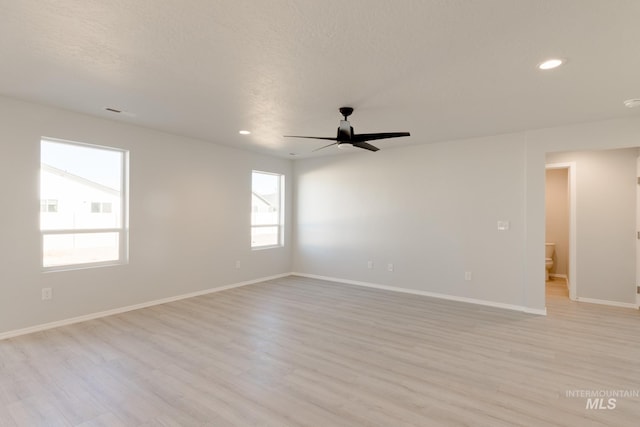 2059 N Thunderbolt St, Mountain Home, ID 83647 - unfurnished room featuring light wood-style flooring, a ceiling fan, recessed lighting, baseboards, and a smoke detector