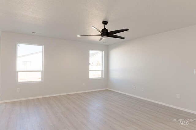 2059 N Thunderbolt St, Mountain Home, ID 83647 - empty room featuring wood finished floors, a ceiling fan, and baseboards
