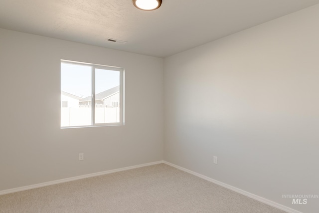 2059 N Thunderbolt St, Mountain Home, ID 83647 - unfurnished room with baseboards and light carpet