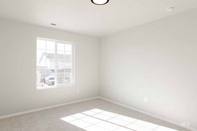 2059 N Thunderbolt St, Mountain Home, ID 83647 - spare room featuring carpet flooring, a smoke detector, and baseboards