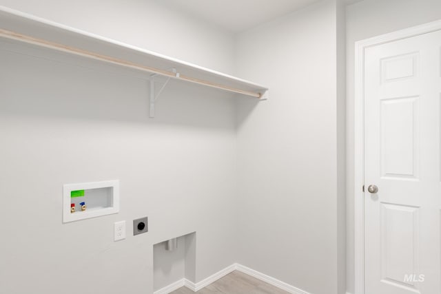 2059 N Thunderbolt St, Mountain Home, ID 83647 - laundry room featuring hookup for an electric dryer, hookup for a washing machine, baseboards, and light wood-style floors