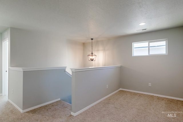 2059 N Thunderbolt St, Mountain Home, ID 83647 - empty room featuring carpet floors, a textured ceiling, baseboards, and recessed lighting