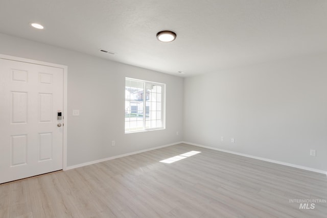 2059 N Thunderbolt St, Mountain Home, ID 83647 - unfurnished room with light wood-type flooring, baseboards, and recessed lighting