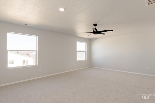2059 N Thunderbolt St, Mountain Home, ID 83647 - unfurnished room with ceiling fan, light carpet, baseboards, a textured ceiling, and recessed lighting