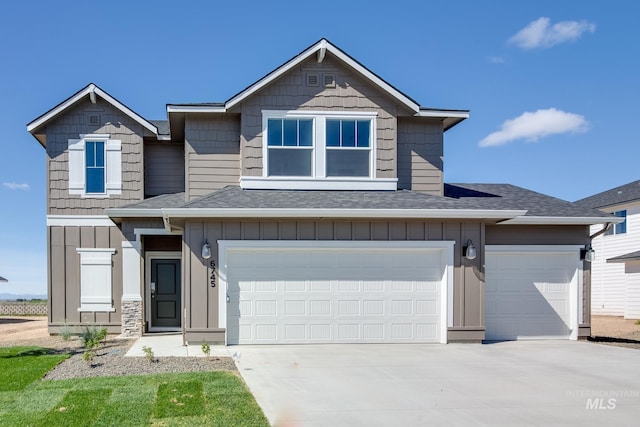 view of front of home with a garage, driveway, a shingled roof, and board and batten siding