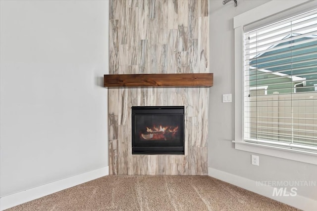 15343 Moss Creek Way, Caldwell, ID 83607 - detailed view of carpet, a glass covered fireplace, and baseboards