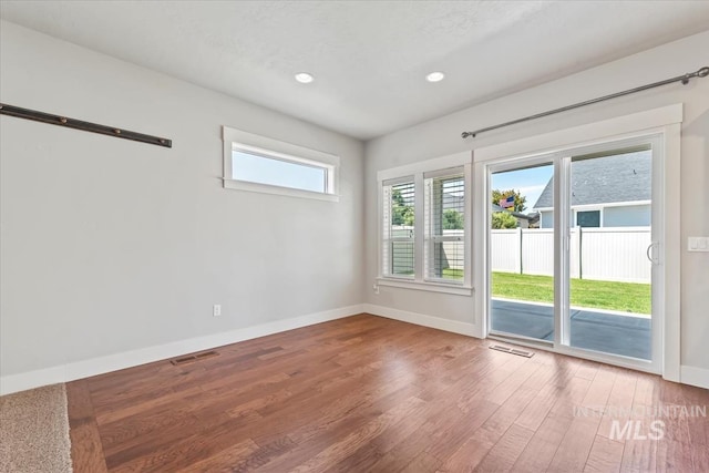 15343 Moss Creek Way, Caldwell, ID 83607 - spare room featuring baseboards, wood finished floors, and recessed lighting