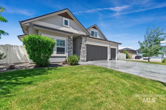 15343 Moss Creek Way, Caldwell, ID 83607 - view of front of property featuring stucco siding, driveway, a garage, and stone siding