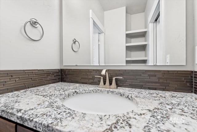 15343 Moss Creek Way, Caldwell, ID 83607 - bathroom featuring backsplash and vanity