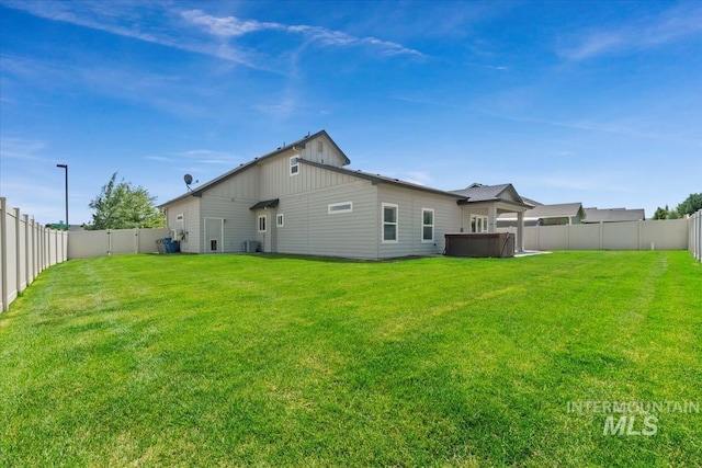 15343 Moss Creek Way, Caldwell, ID 83607 - rear view of house with a hot tub and cooling unit