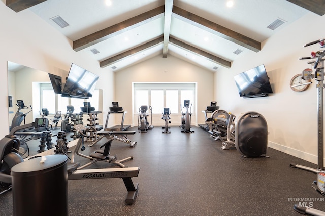 exercise room featuring high vaulted ceiling, a healthy amount of sunlight, visible vents, and baseboards