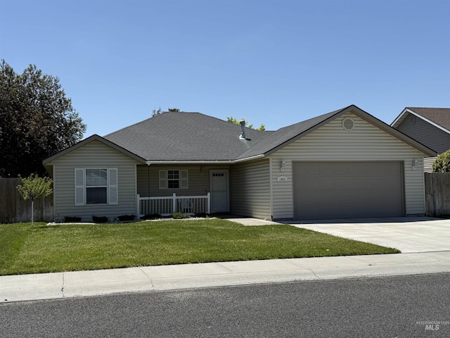 1053 Caswell Ave W, Twin Falls, ID 83301 - ranch-style home with an attached garage, a porch, driveway, and a shingled roof