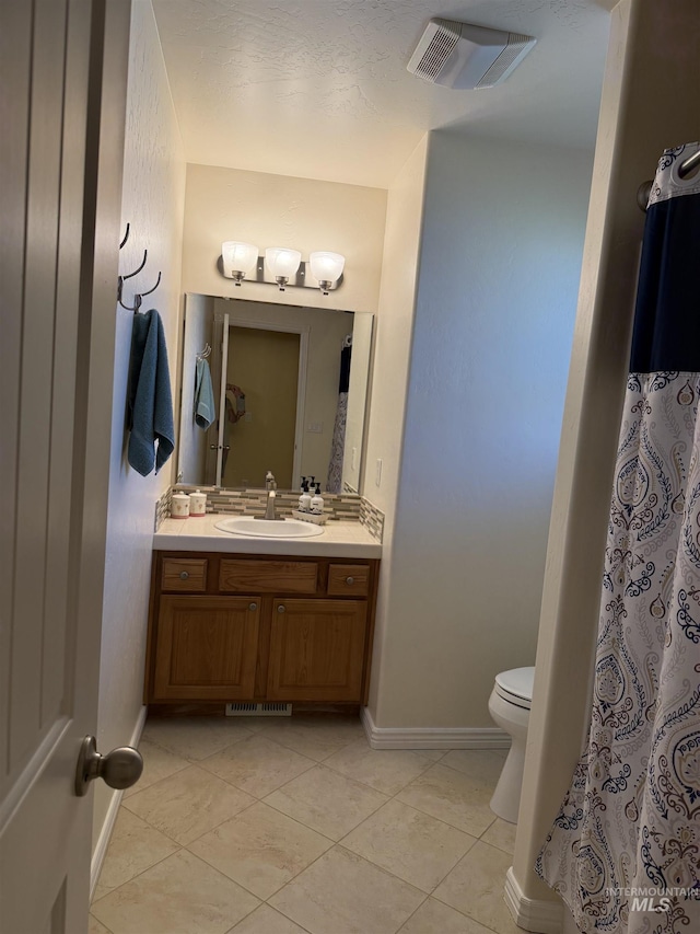 1053 Caswell Ave W, Twin Falls, ID 83301 - bathroom with vanity, tile patterned floors, toilet, and baseboards