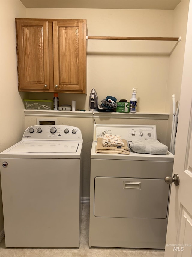 1053 Caswell Ave W, Twin Falls, ID 83301 - laundry room featuring washing machine and dryer and cabinet space