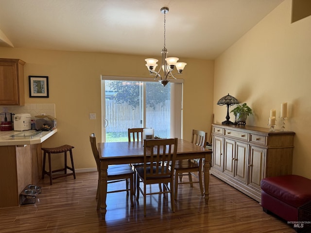 1053 Caswell Ave W, Twin Falls, ID 83301 - dining area featuring a chandelier, dark wood-style floors, baseboards, and lofted ceiling