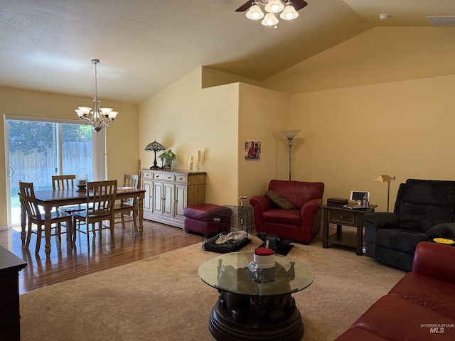 1053 Caswell Ave W, Twin Falls, ID 83301 - living room featuring carpet flooring, lofted ceiling, a chandelier, and a ceiling fan