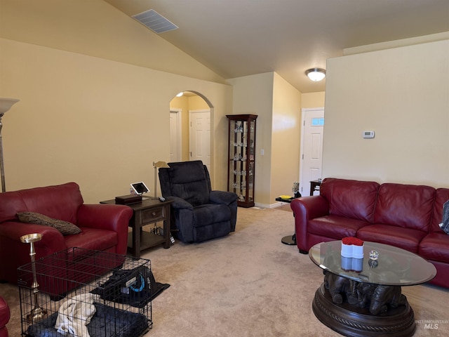 1053 Caswell Ave W, Twin Falls, ID 83301 - living room featuring arched walkways, carpet floors, and lofted ceiling