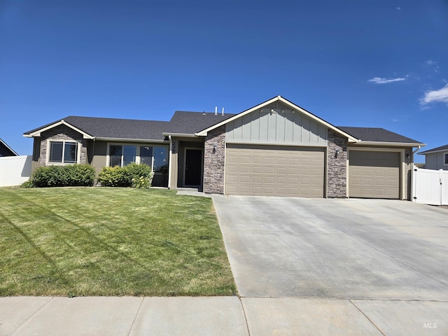 235 Meadow View Dr, Payette, ID 83661 - single story home with a garage, driveway, board and batten siding, and stone siding