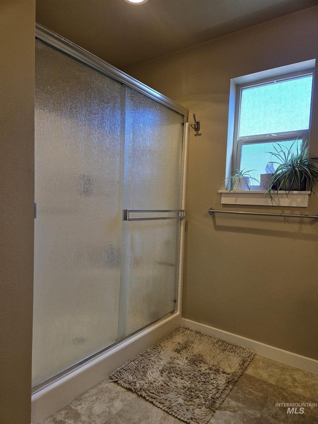 235 Meadow View Dr, Payette, ID 83661 - bathroom with a shower stall and baseboards