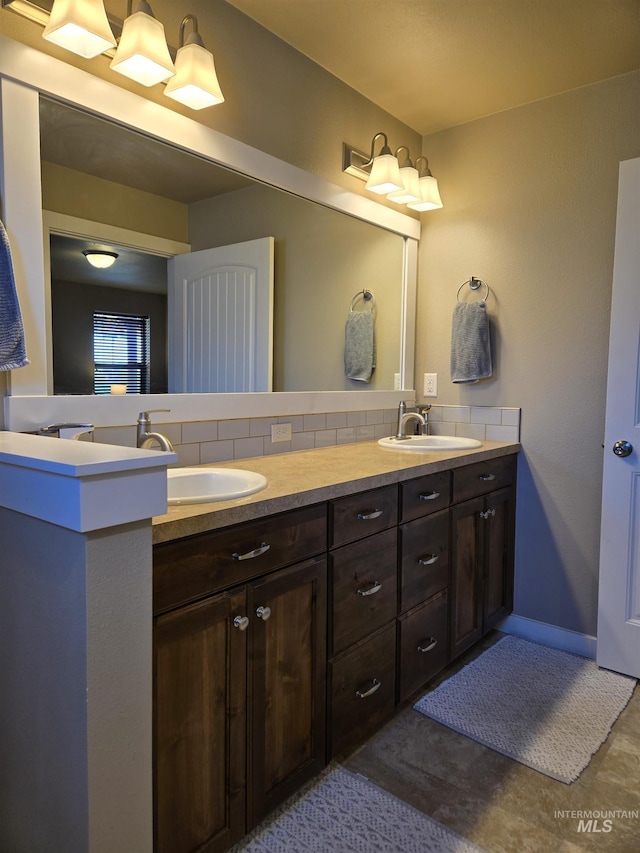 235 Meadow View Dr, Payette, ID 83661 - bathroom featuring double vanity and decorative backsplash