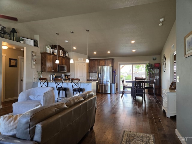 235 Meadow View Dr, Payette, ID 83661 - living area featuring dark wood finished floors, recessed lighting, and lofted ceiling