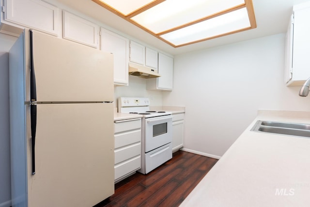 kitchen featuring sink, white appliances, white cabinets, and dark wood-type flooring