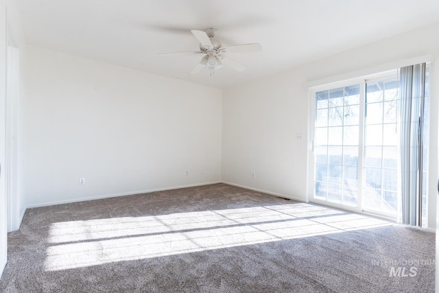 carpeted empty room with ceiling fan