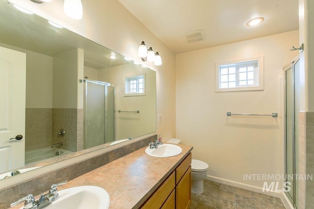 1962 E 6th St, Moscow, ID 83843 - bathroom featuring a shower stall, plenty of natural light, and a sink