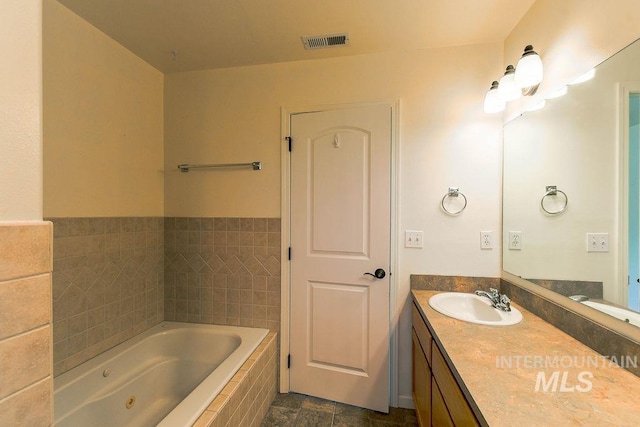 1962 E 6th St, Moscow, ID 83843 - bathroom featuring a jetted tub, vanity, and visible vents