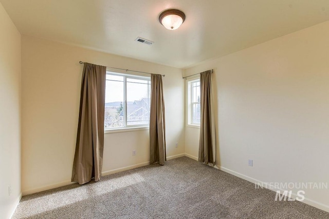 1962 E 6th St, Moscow, ID 83843 - unfurnished room featuring light carpet, baseboards, and visible vents