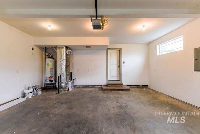 1962 E 6th St, Moscow, ID 83843 - garage with water heater, a garage door opener, and electric panel