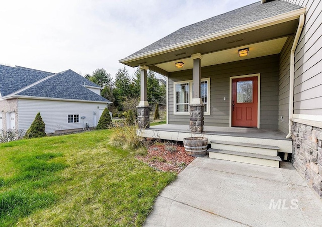 1962 E 6th St, Moscow, ID 83843 - entrance to property featuring roof with shingles, a porch, and a lawn