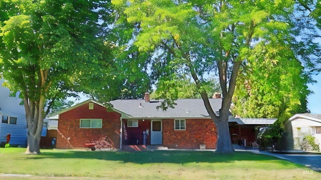 1316 Arlington Ave, Caldwell, ID 83605 - view of front of home featuring a chimney, brick siding, and a front lawn