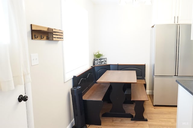 dining space featuring light hardwood / wood-style floors