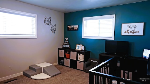 1316 Arlington Ave, Caldwell, ID 83605 - carpeted bedroom featuring baseboards and multiple windows