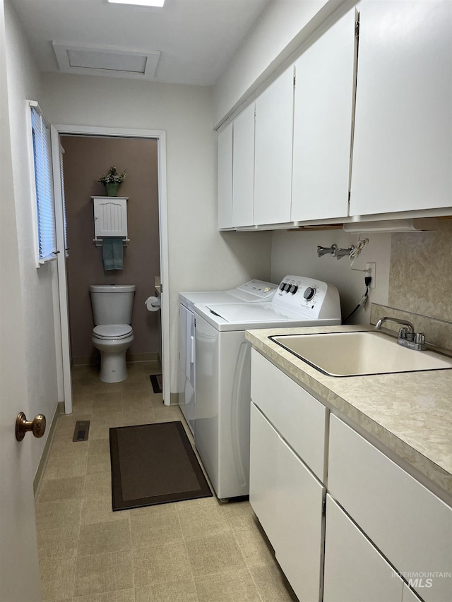 354 W Syringa Ct, Lewiston, ID 83501 - washroom with independent washer and dryer, attic access, cabinet space, and baseboards