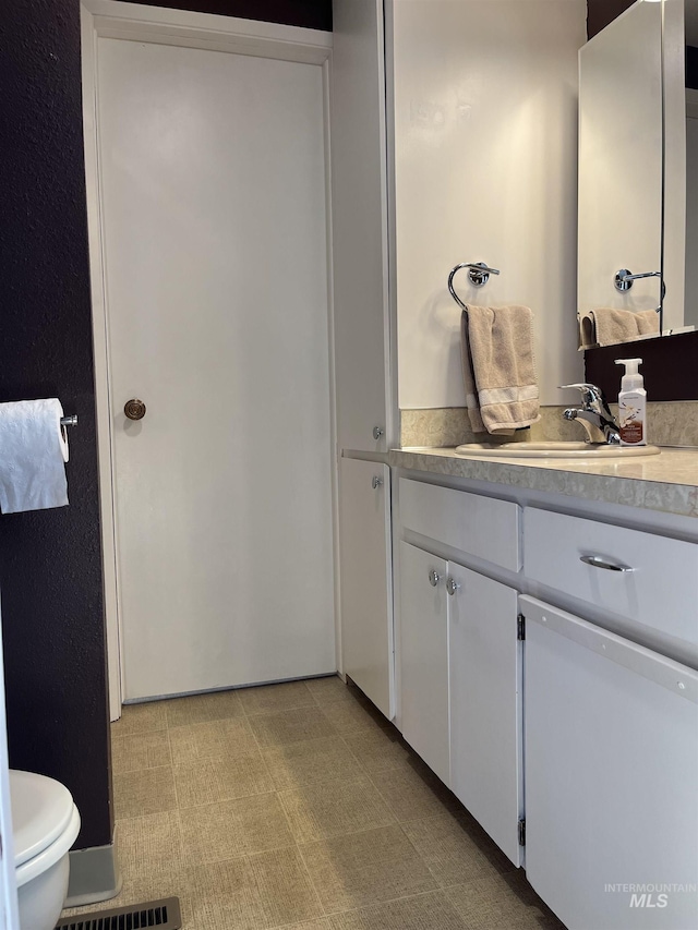 354 W Syringa Ct, Lewiston, ID 83501 - bathroom featuring vanity, toilet, and tile patterned floors
