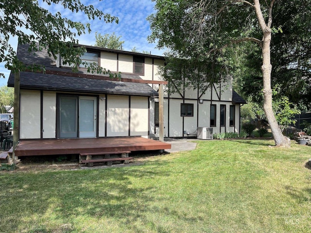 354 W Syringa Ct, Lewiston, ID 83501 - back of house with stucco siding, a wooden deck, a yard, and roof with shingles