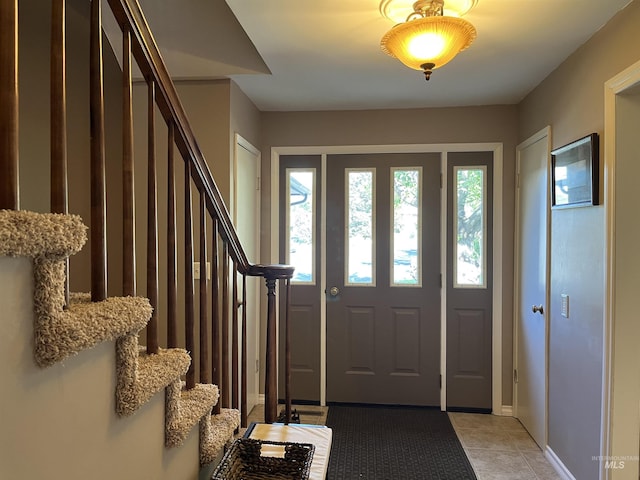 354 W Syringa Ct, Lewiston, ID 83501 - foyer with stairway, light tile patterned floors, and baseboards