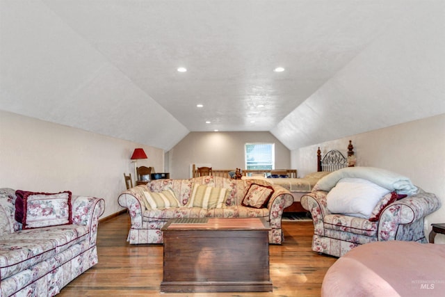 living room with recessed lighting, vaulted ceiling, and wood finished floors