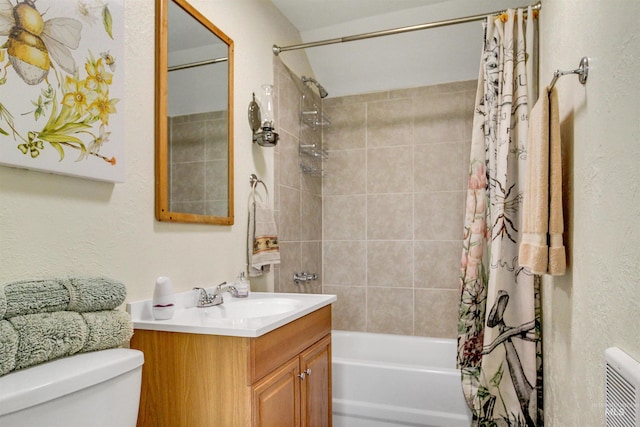 bathroom featuring toilet, vanity, and shower / tub combo with curtain