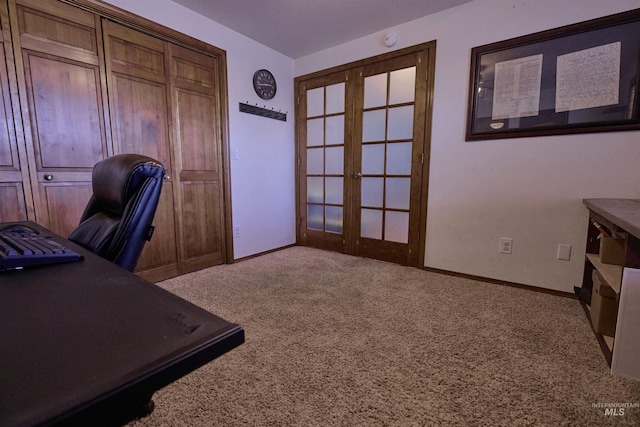 carpeted office with french doors and baseboards