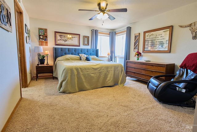 bedroom with carpet, baseboards, and ceiling fan