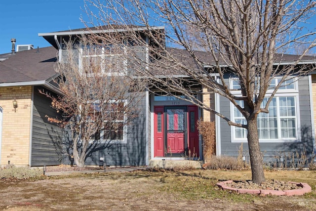 view of front of house featuring brick siding