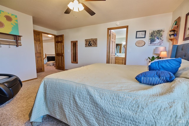 carpeted bedroom featuring ensuite bath and a ceiling fan