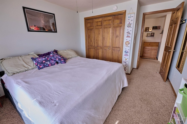 bedroom with a closet and light colored carpet