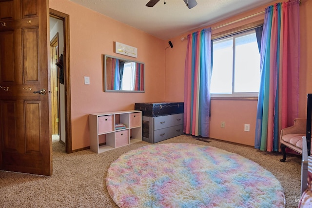 carpeted bedroom with visible vents and ceiling fan