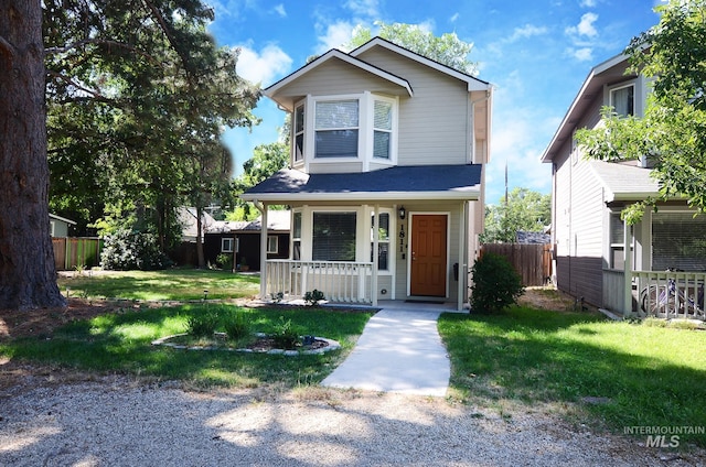 view of front of home featuring a porch and a front yard