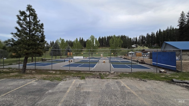 24 Shady Ln, Garden Valley, ID 83622 - view of pool with a tennis court and a wooded view